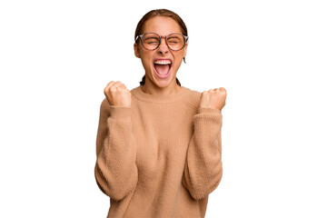 Young caucasian woman isolated cheering carefree and excited. Victory concept.