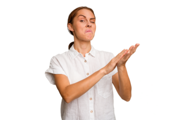 Young caucasian woman isolated feeling energetic and comfortable, rubbing hands confident.