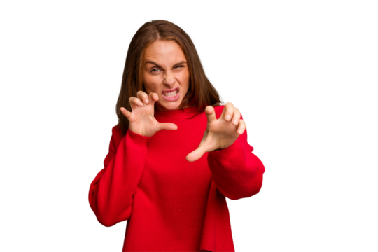 Young caucasian woman isolated showing claws imitating a cat, aggressive gesture.
