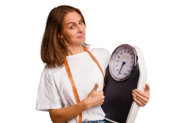 Young nutritionist caucasian woman holding scale and mesure tape isolated