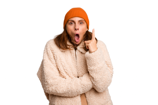 Young caucasian woman wearing winter clothes isolated having some great idea, concept of creativity.