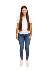 Young asian woman standing, full body cutout isolated funny and friendly sticking out tongue.