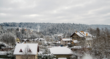 View from the hotel window on a snowy village in the Carpathians.