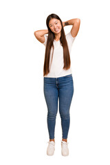 Young asian woman standing, full body cutout isolated stretching arms, relaxed position.