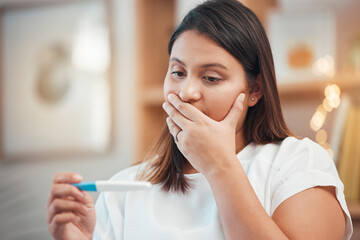 Pregnancy test, wow and woman with results, reading information and stress about stick. Surprise, worry and face of a pregnant woman shocked with a test for fertility or ovulation in a house - obrazy, fototapety, plakaty
