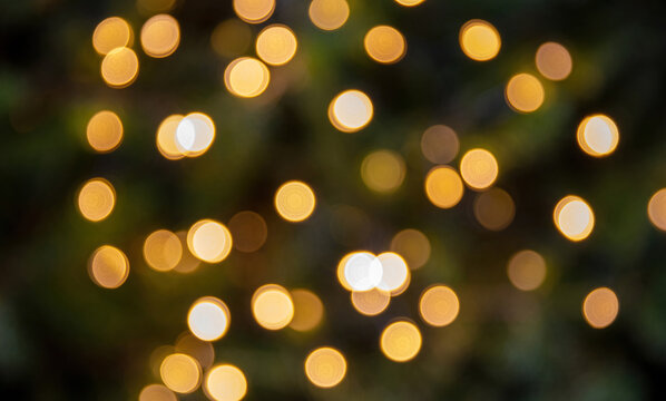Bokeh lights background. Blur Christmas tree and decoration close up.