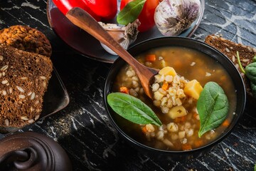 Homemade soup- dark photo. Background food- still life nosh. Serving meals in the home kitchen. Cook meals for the family