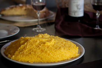 Polenta at the traditional sunday lunch table. Close up