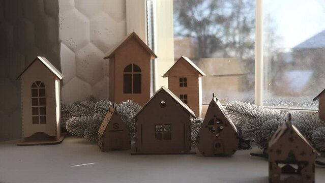 wooden houses on the windowsill, New Year's decor