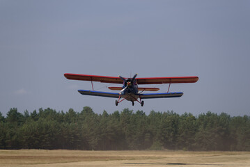AIRPLANE - The biplane takes off from airfield
