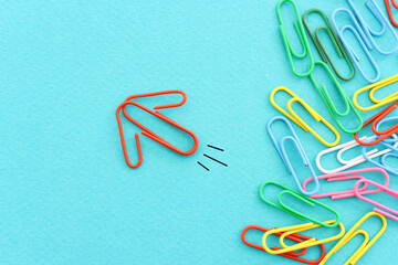Concept image of unique thinking. Paper clips in the shape of airplane. Idea of teamwork and leadership