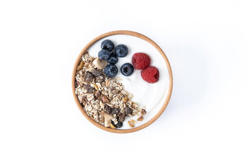 Yogurt with berries and muesli for breakfast in bowl