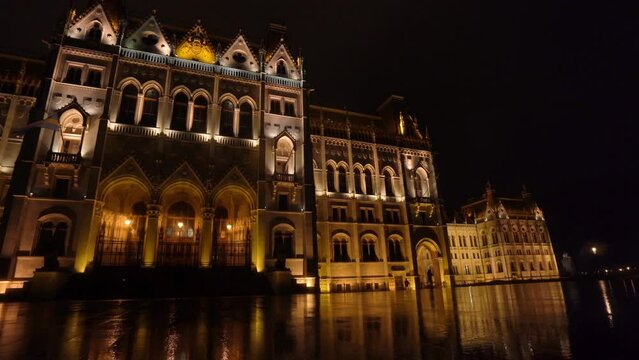 Facade at Night of the Hungarian Parliament Building In Budapest Under the Rain - Pan Left