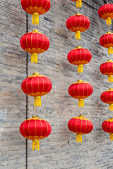 Fototapeta premium Red lanterns on the city wall
