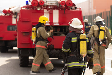 A brigade of firefighters deploys equipment for tasks