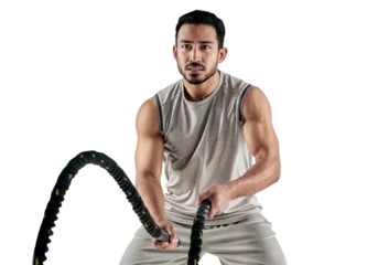 Foto op Canvas PNG studio shot of a muscular young man exercising with battle ropes. © Suresh/peopleimages.com
