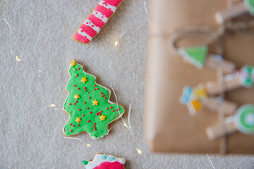 Christmas gift in kraft paper and gingerbread cookies