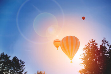 balloons against the setting sun