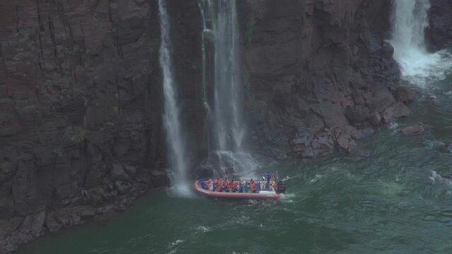 boat with tourists as an attraction at iguazu falls