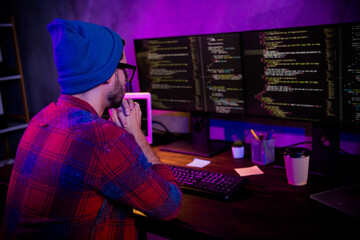 Photo of thoughtful confident guy dressed glasses hat thinking new java script indoors workstation workshop home