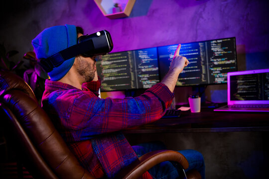 Photo of dreamy excited programmer wear spectacles pointing finger modern device indoors workplace workshop home