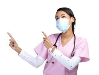 PNG cropped shot of an attractive young female healthcare worker wearing a mask and pointing towards copyspace in studio.