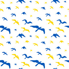 Seamless pattern with flying birds in Ukrainian flag yellow and blue colors. Vector illustration