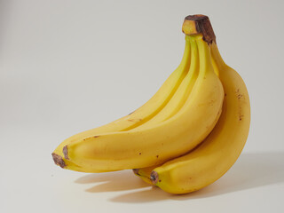 isolated cluster of bananas in close-up on a white background.