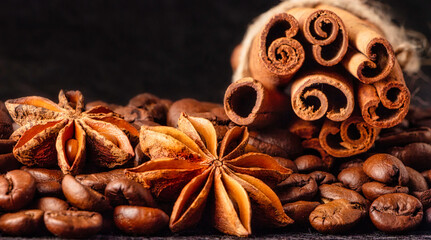Anise, coffee beans and cinnamon. Coffee still life low key.