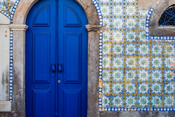 Blue tiled door in Tavira Portugal