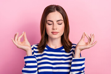Portrait of calm pretty girl closed eyes arms fingers meditate concentrate isolated on pink color background
