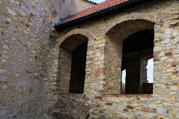 Fototapeta premium Casement windows of a medieval fortress. Background with selective focus and copy space