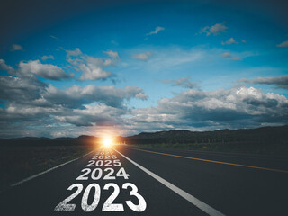New Year direction concept and sustainable development concept On the road labeled 2023 to 2027 at...