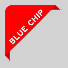 Red color of corner label banner with word blue chip on gray background