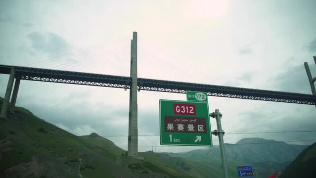 Guozigou Bridge (Talki Bridge) Against Cloudy Sky. Cable-stayed Bridge In Xinjiang, China. low angle