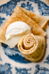 homemade russische crepes on blue english plate