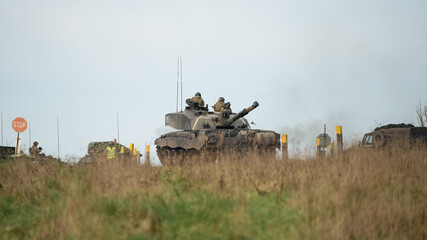 commander and gunner directing action on a British army FV4034 Challenger 2 ii main battle tank at...