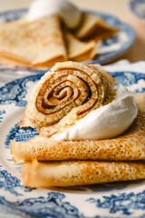 homemade russische crepes on blue english plate