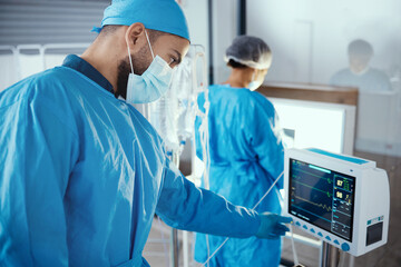 Doctor, hospital and medical machine with monitor screen during surgery for dialysis, healthcare...