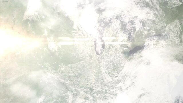 Earth zoom in from outer space to city. Zooming on Elgin, Illinois, USA. The animation continues by zoom out through clouds and atmosphere into space. Images from NASA