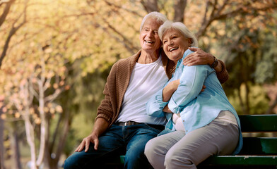 Senior couple, park bench and happy while sitting together in retirement for freedom, peace and...