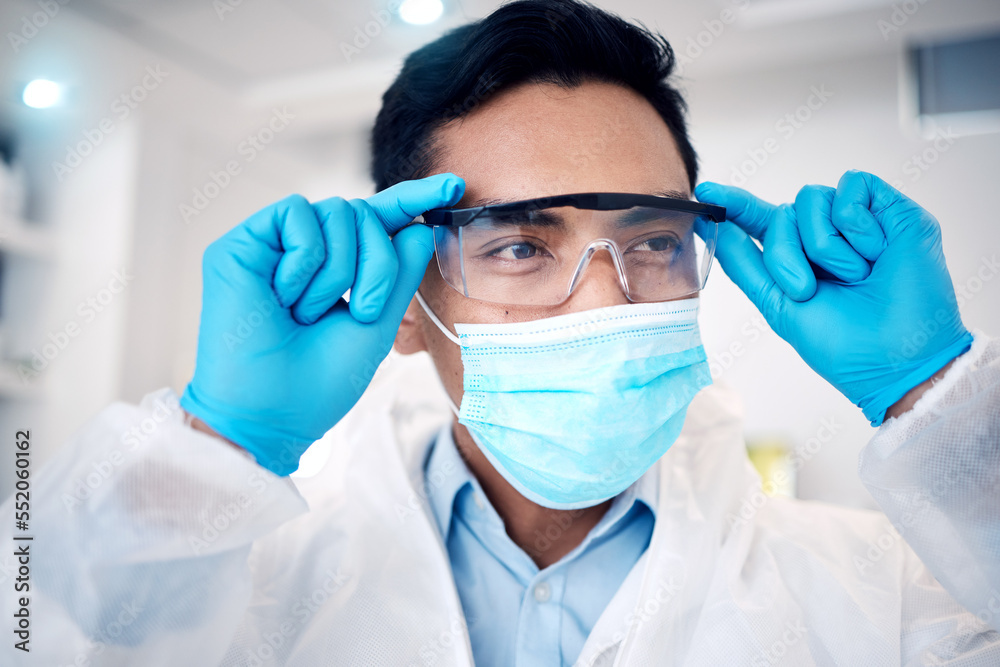 Poster covid, science and goggles with a man at work on research or innovation in a laboratory as a scienti