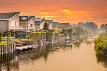 Fototapeta premium Homes on water edge in residential area