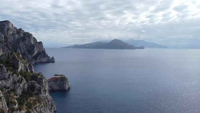 Rocky coastline of Capri and Sorrento island in distance, aerial view