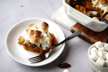 Homemade Sweet potato casserole topped with toasted marshmallows - holiday foods