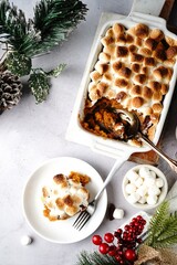 Homemade Sweet potato casserole topped with toasted marshmallows - holiday foods