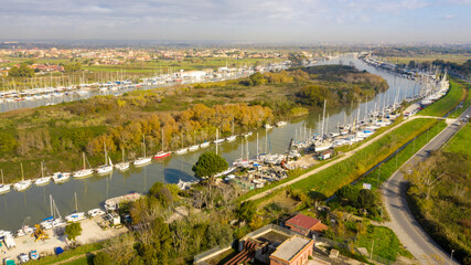 Aerial view on the Holy Isle located in Fiumicino, Italy. It' s an artificial island on the Tiber River, near Rome. Many boats are anchored.