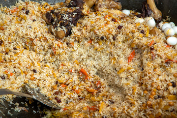 One of the main ingredients of the plov dish is rice and carrots.