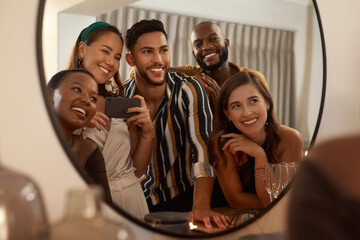 Group of friends, phone and mirror selfie for party, celebration or New Years together. Young...
