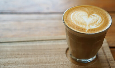A cup of coffee latte with artistic heart shaped latte art